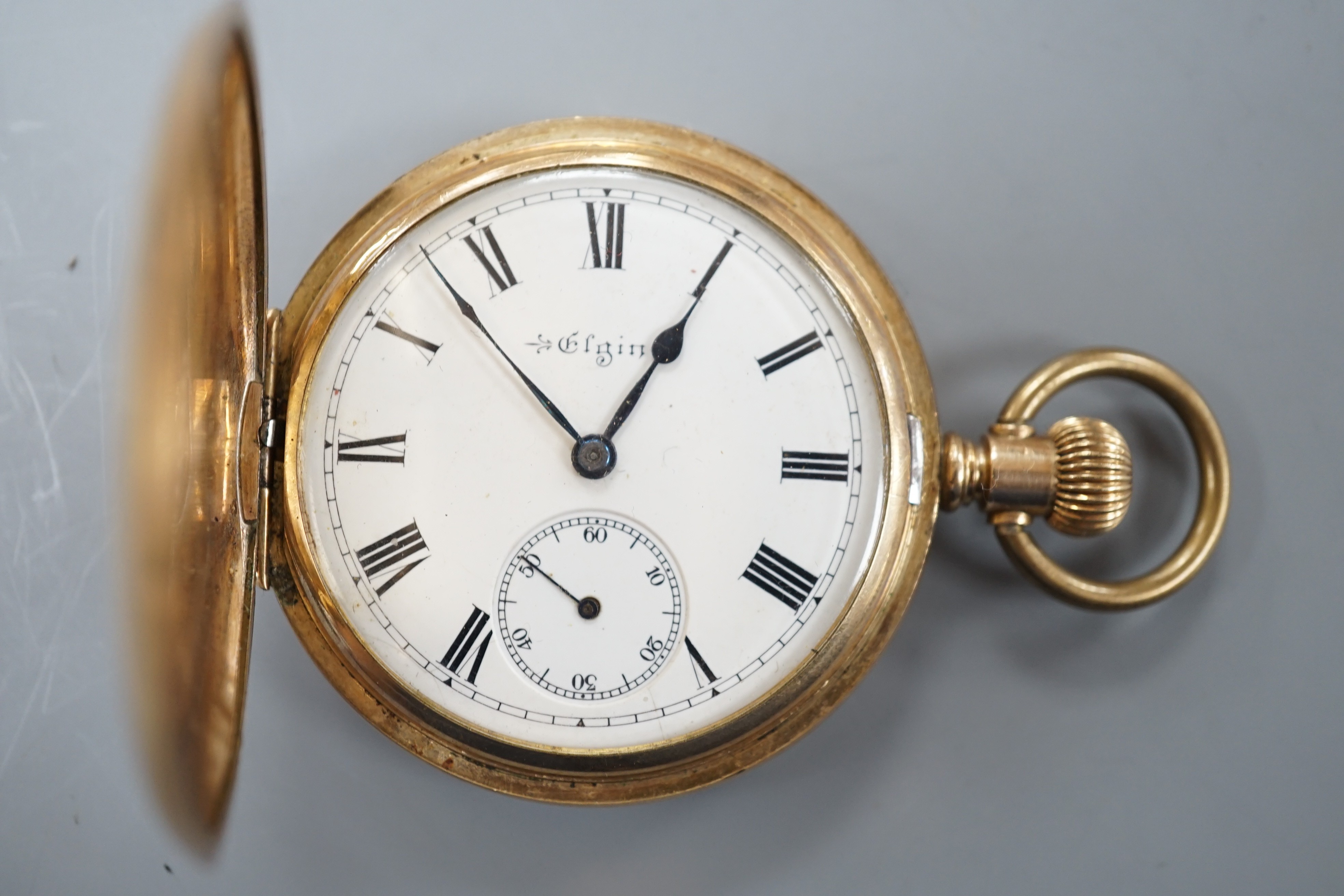 An Elgin gold plated hunter keyless pocket watch, with Roman dial and subsidiary seconds, the case with engraved monogram.